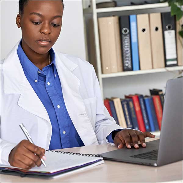 Photo of researcher taking notes