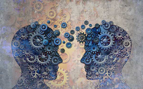Graphic depicting two abstract heads sharing ideas