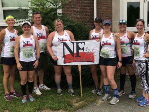 Runners celebrate finishing the Falmouth Road Race